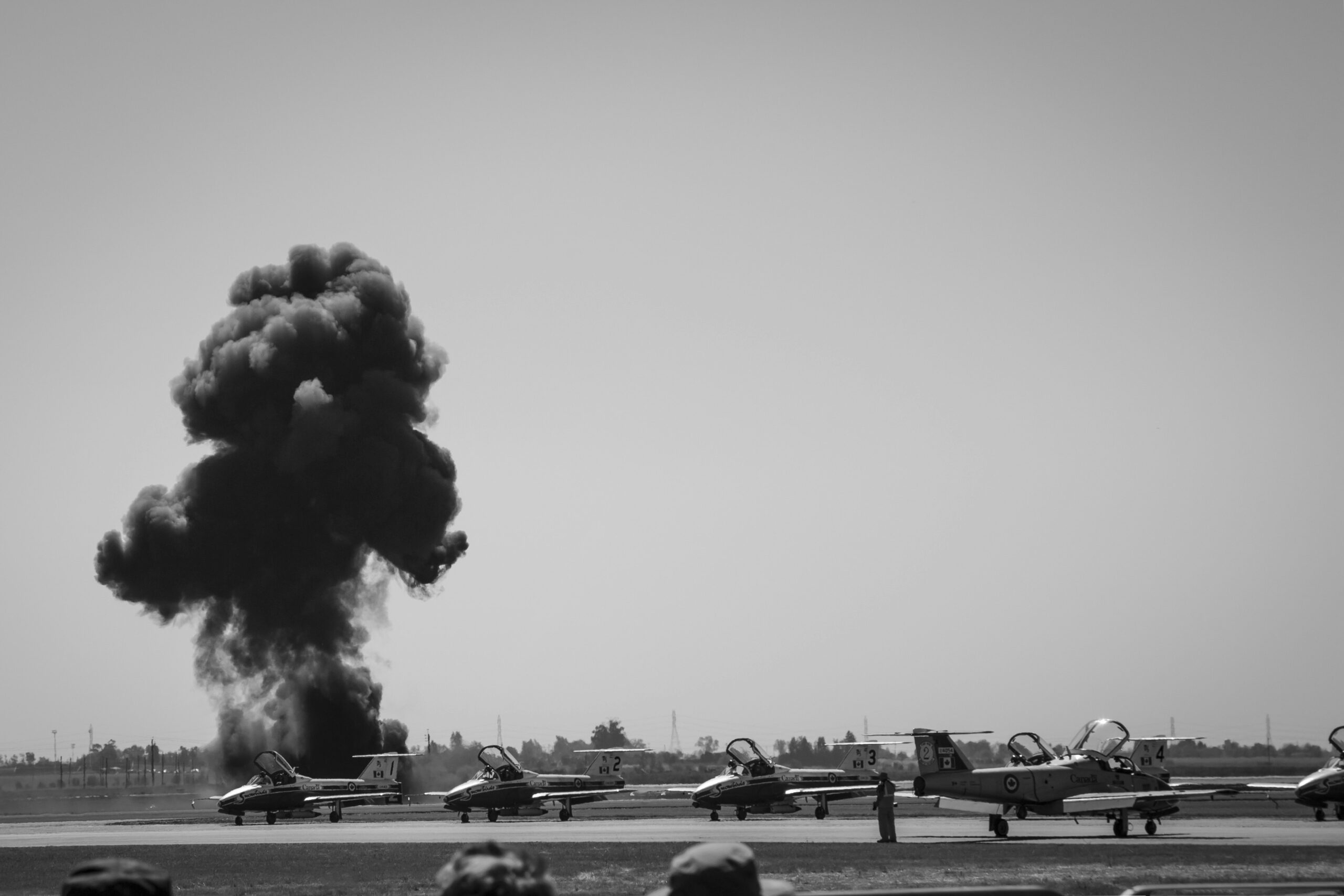 a group of planes on a runway