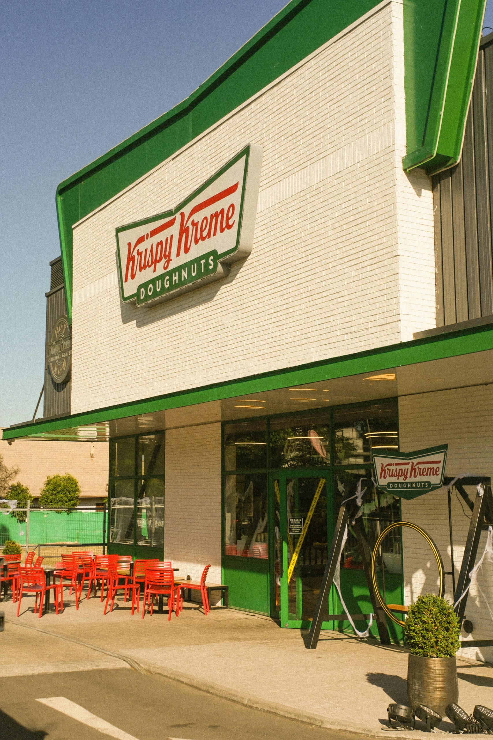 Krispy kreme doughnuts shop exterior with outdoor seating